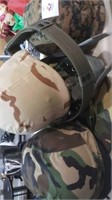 Three helmets couple belts camo hat