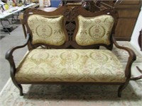 ANTIQUE CARVED UPHOLSTERED PADDED LOVESEAT