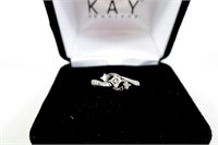 14K White gold three diamond swirl style ring with