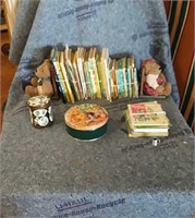 Children's books and bear bookends with 2 tins