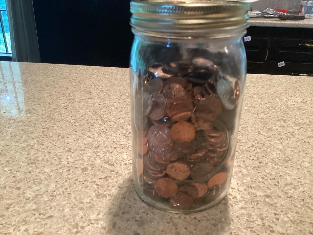 Mason Jar of coins mostly pennies