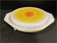 Retro Pyrex Daisy Covered Casserole Dish.