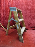 Small folding wood step ladder.