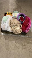 Assorted yarn, knitting wheels, knitting items