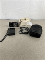 Canon digital camera with charger and case. Gait