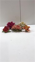 Porcelain rose figures 
Small red one is broke