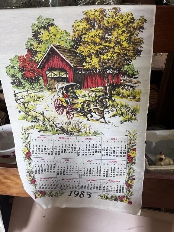 cat figures with stone and 1983 calender