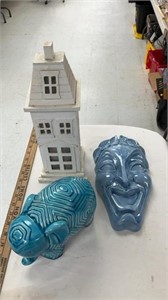 Clay elephant and face, house