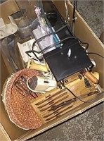 Box with knives, lamp, iron, and more