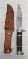 Fixed blade knife with wood and resin handle and