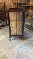 Glass shelved claw footed cabinet