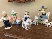 Seven Porcelain Figures including Poodles, Sailors
