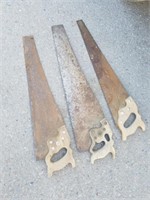 Three vintage saws one is a Disston