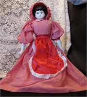 Porcelain Doll in red gingham dress