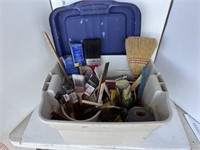 Tote of paintbrushes, tape, misc