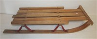 Old snow sled with wood runners. Measures 37"