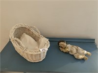 SLEEPING BABY WITH GOLD PAINTED DETAIL IN BASKET