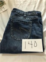 USED WOMENS SILVER JEANS W33 L35