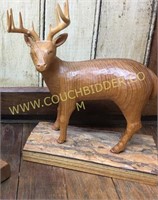 Carved white tail buck