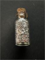Glass Jar of Silver Flakes
