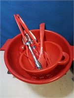 Red plastic strainer mixing bowl and kitchen tools