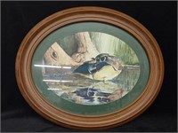 Duck painting and oval frame