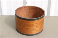 Wooden cheese box with metal bands