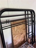 Metal twin over twin bedframe with rails.