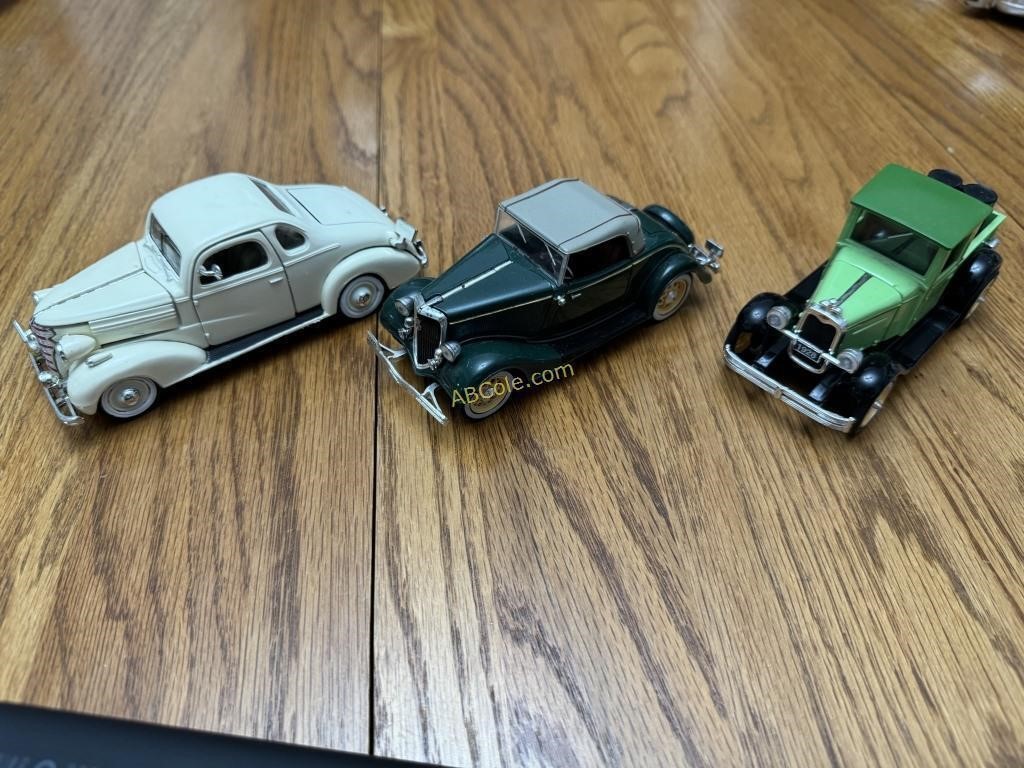 3- antique mini model vehicles