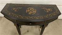 Gold painted details on black console table- FL