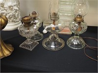 Four vintage oil lamps including two