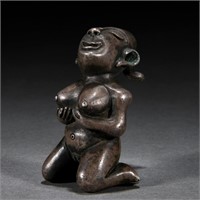 A Chinese Silver Kneeling Figure