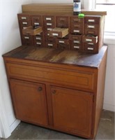 Shop cabinet, small drawers has contents