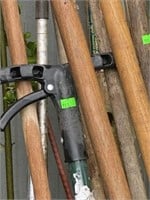Assorted yard tools, post hole digger, planter,