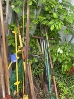 Assorted yard tools, shovels, pick ax