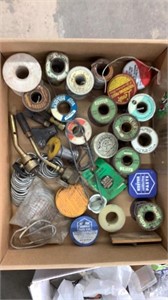 Multiple rolls of solder, hand, brooms, fire, and