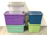 Group of six plastic storage totes with lids