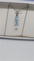 Blue and white stone pendant marked karis and