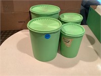 4 green tupperare canisters
