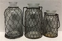 3 VINTAGE GLASS JARS IN METAL CAGES