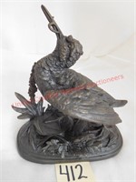 Cast bronze bird with worm in mouth