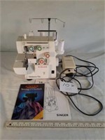 Singer serger and box of thread & needles