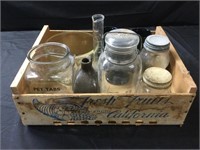 Canning jars, wood crate, glass containers