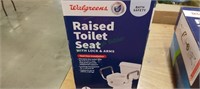 Raised toilet seat