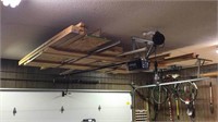 Miscellaneous lumber hanging above the garage