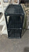 Black plastic shelving unit