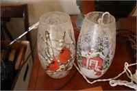 2 lighted cardinal vases