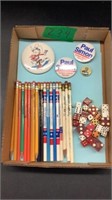 Assorted badges, pencils, dice
