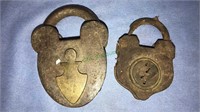 Two antique padlocks with no keys, the large one