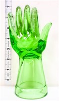 Green glass jewelry hand